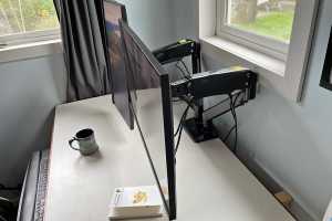 Why you need a monitor mount for your college dorm's desk